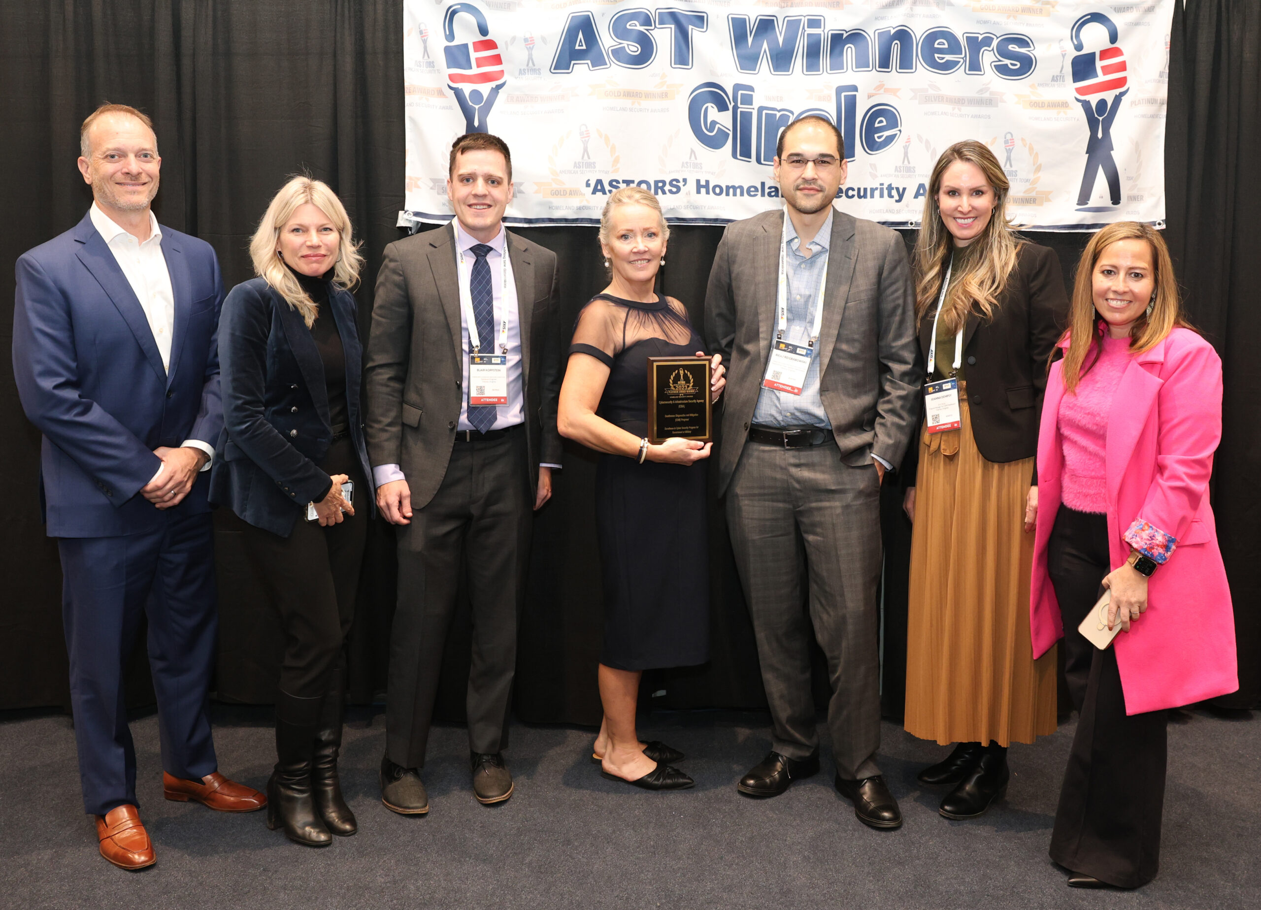 Representatives of CISAs CDM Program, including Richard Grabowski, Deputy Branch Chief, Capability Implementation and Acting Program Manager for the Continuous Diagnostics and Mitigation (CDM) Program within the Cybersecurity and Infrastructure Security Agency (CISA), Cybersecurity Division (third from right), accept one of two Excellence in Public Safety and Community Resilience awards in the 2023 ASTORS Homeland Security and Excellence in Public Safety Awards Program in New York City at ISC East.